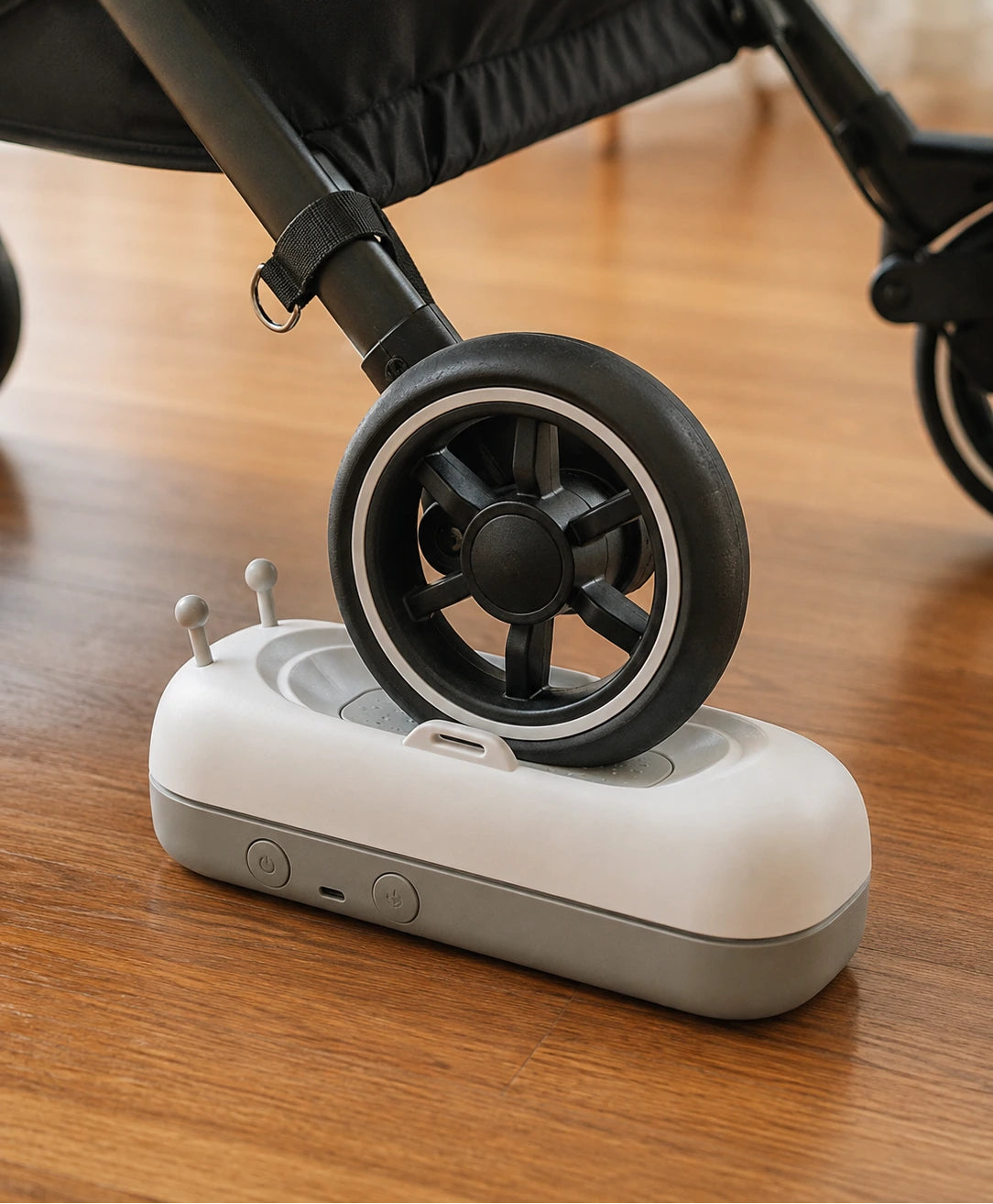 Sway positioned under a pram wheel
